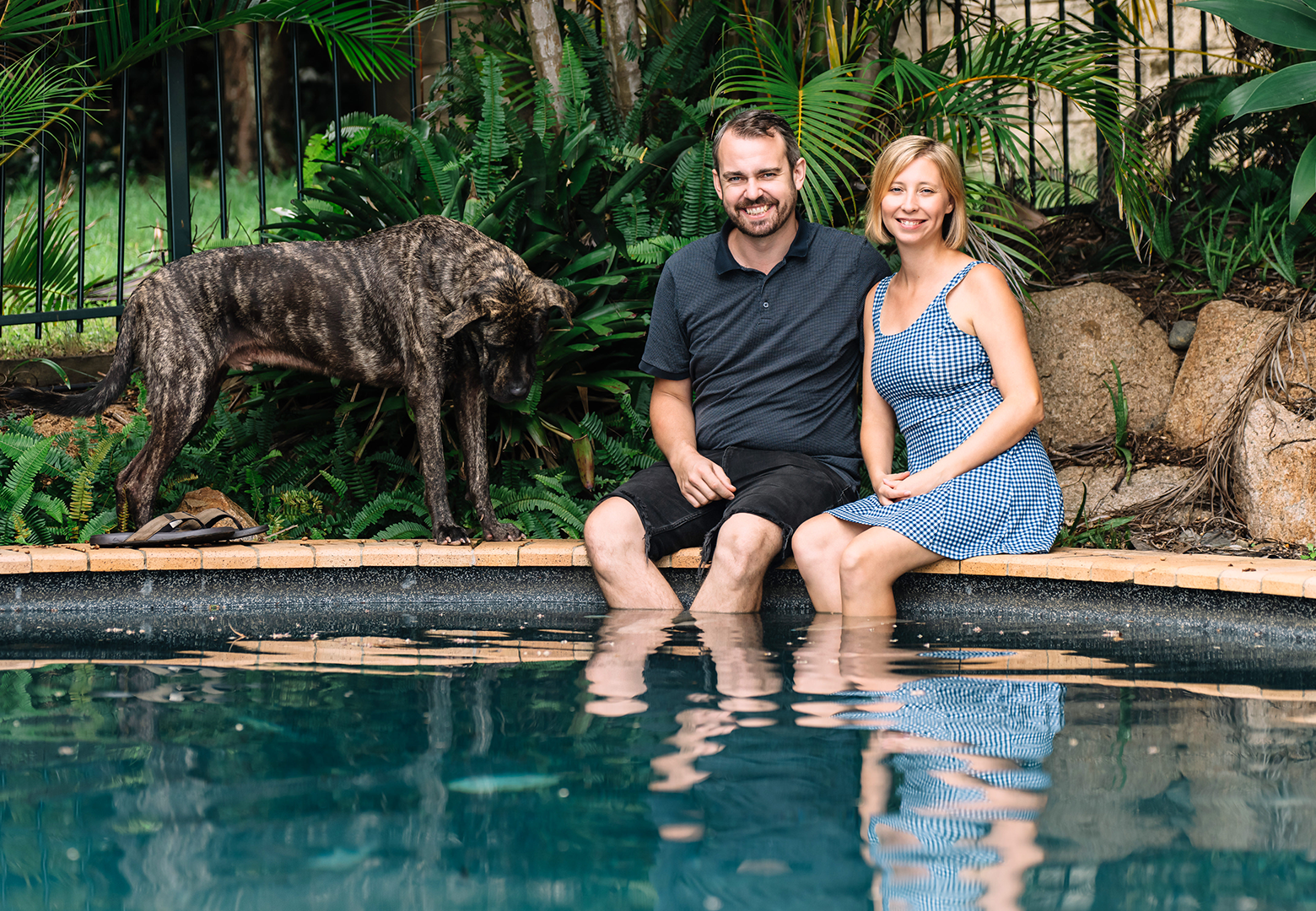 Stockspot clients sitting by the pool at their home